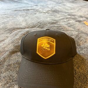 Black Cap with Gold Emblem